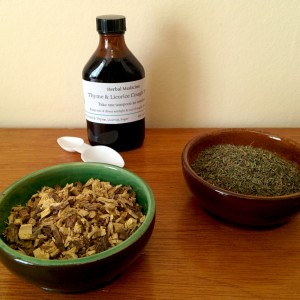 Dried thyme & licorice in bowls with bottle of syrup
